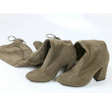 leather women shoes on knee