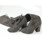 leather women shoes on knee