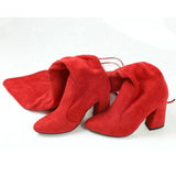 leather women shoes on knee