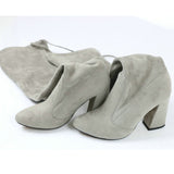 leather women shoes on knee